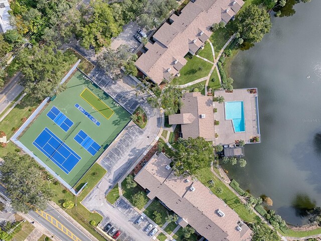 birds eye view of property with a water view