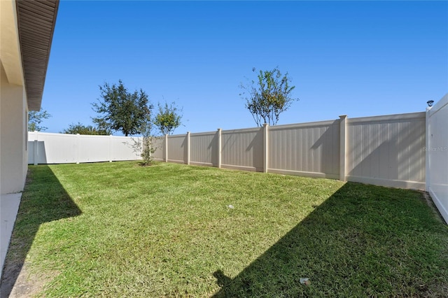 view of yard featuring a fenced backyard