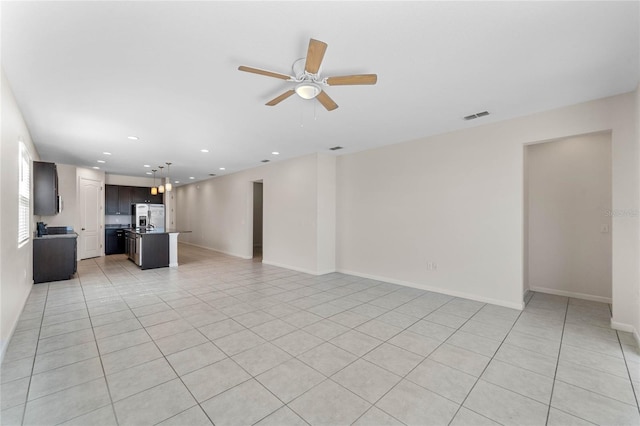 unfurnished living room featuring light tile patterned floors, recessed lighting, visible vents, and a ceiling fan