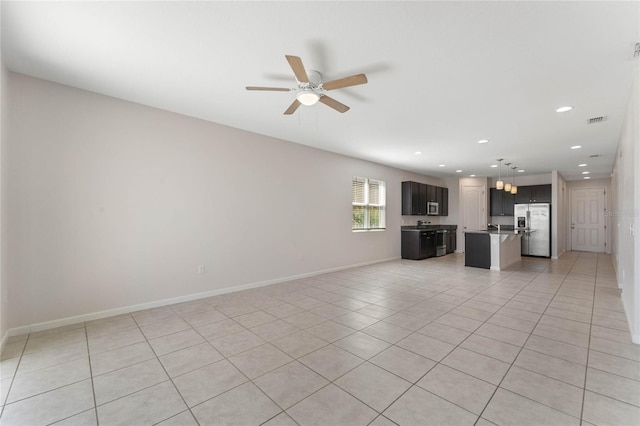 unfurnished living room with light tile patterned floors, recessed lighting, visible vents, a ceiling fan, and baseboards