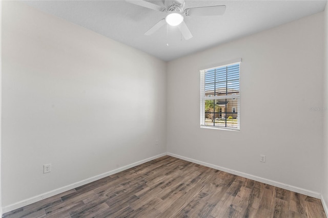 unfurnished room featuring wood finished floors, a ceiling fan, and baseboards