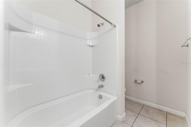 bathroom with baseboards, bathtub / shower combination, toilet, and tile patterned floors