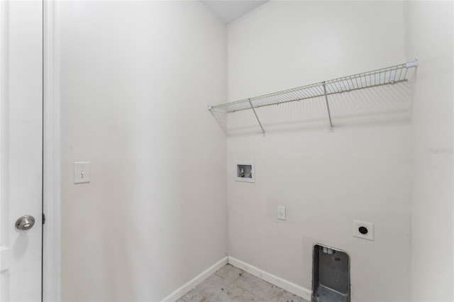 laundry area with laundry area, hookup for a washing machine, baseboards, and hookup for an electric dryer