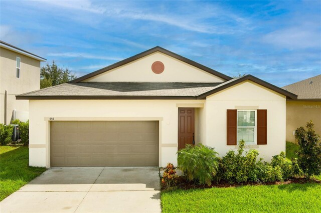 ranch-style house with an attached garage, roof with shingles, concrete driveway, and stucco siding