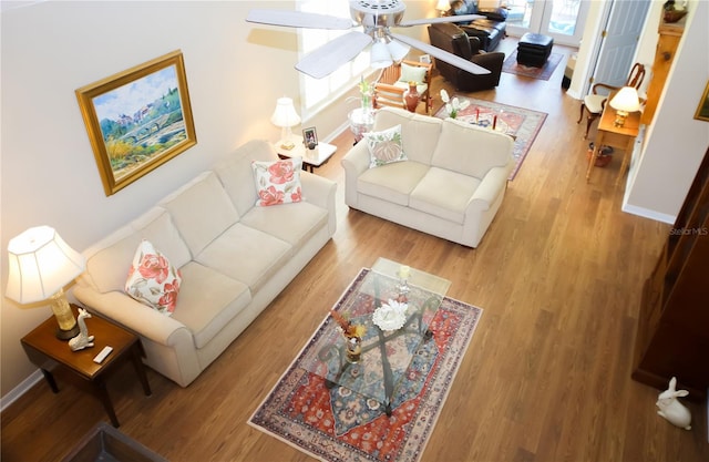 living room with hardwood / wood-style flooring and ceiling fan