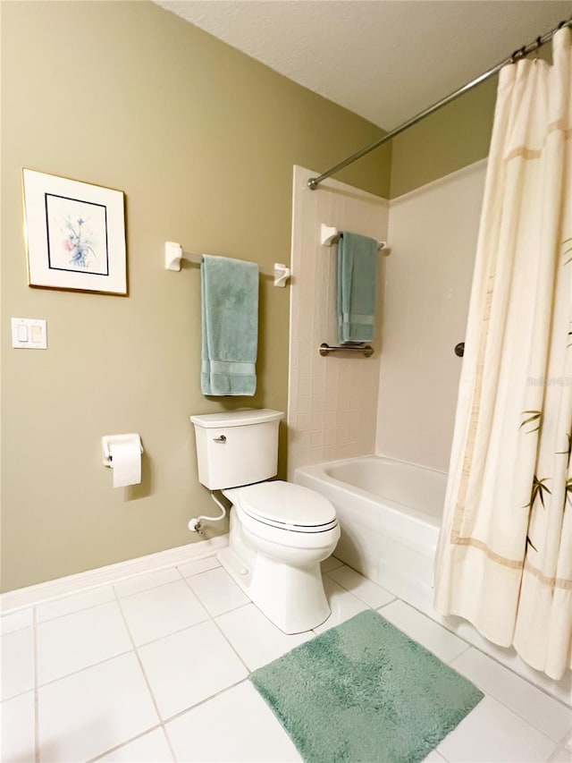 bathroom with shower / bath combination with curtain, tile patterned floors, and toilet