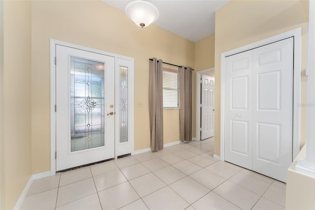 doorway featuring light tile patterned flooring