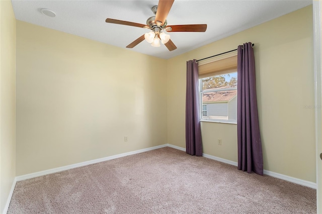 carpeted empty room with ceiling fan