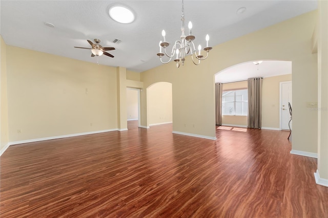 unfurnished room featuring a textured ceiling, ceiling fan with notable chandelier, and dark hardwood / wood-style flooring