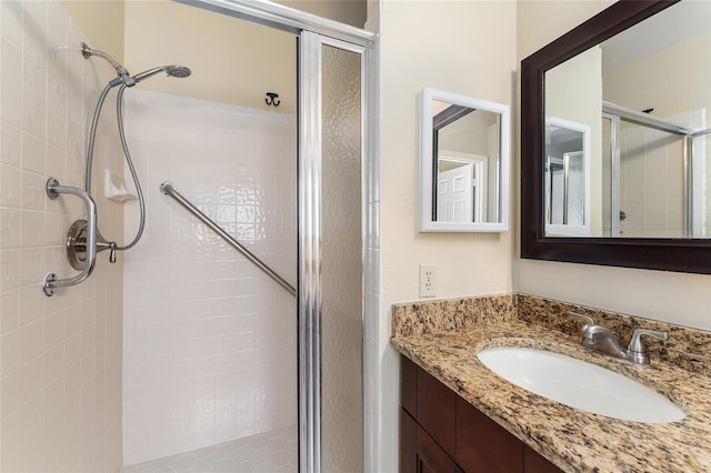 bathroom with vanity and an enclosed shower