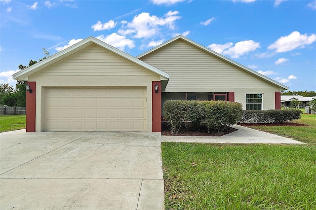 8222 Florida Boys Ranch Rd, Groveland, FL 34736 - view of front of house with an attached garage, stucco siding, driveway, and a front lawn
