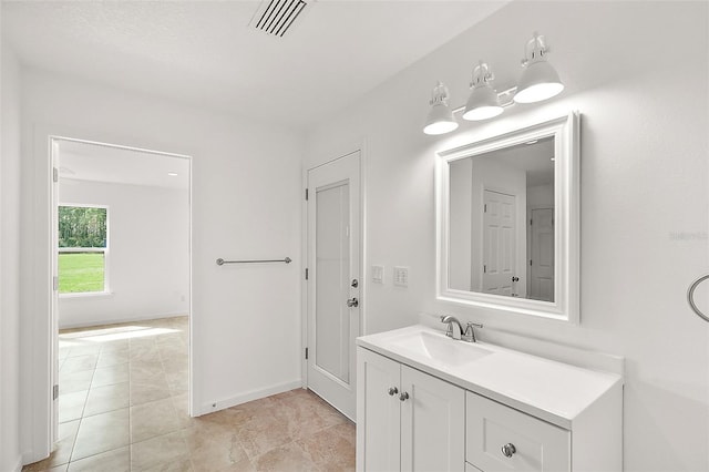 8222 Florida Boys Ranch Rd, Groveland, FL 34736 - bathroom with visible vents, baseboards, and vanity