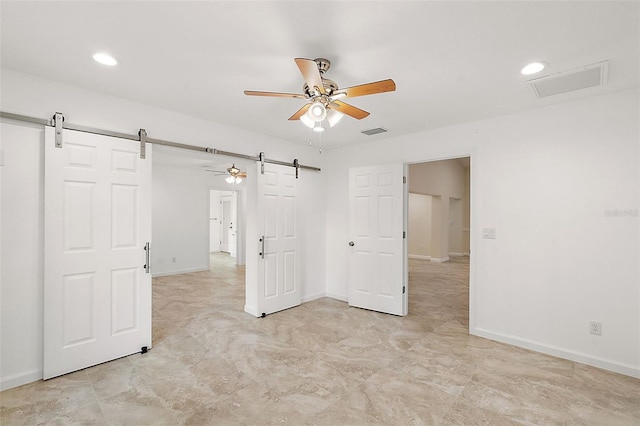 8222 Florida Boys Ranch Rd, Groveland, FL 34736 - interior space with visible vents, a barn door, baseboards, and recessed lighting