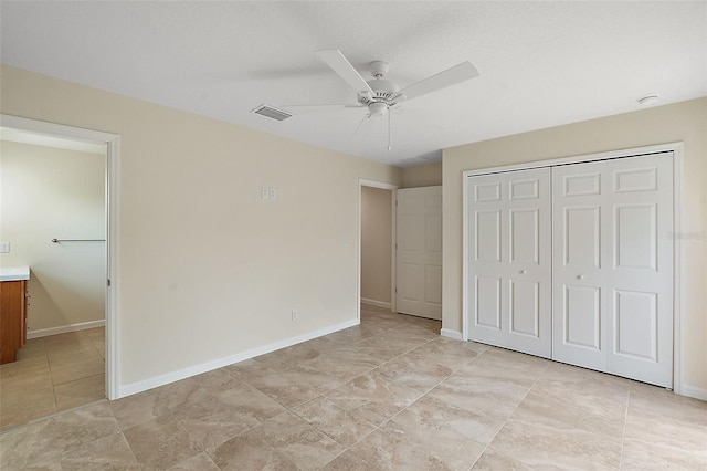 8222 Florida Boys Ranch Rd, Groveland, FL 34736 - unfurnished bedroom featuring baseboards, ceiling fan, a closet, and visible vents