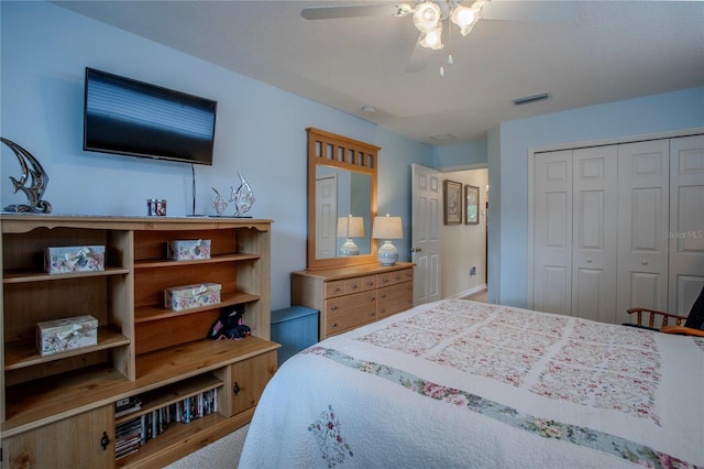 bedroom with ceiling fan and a closet