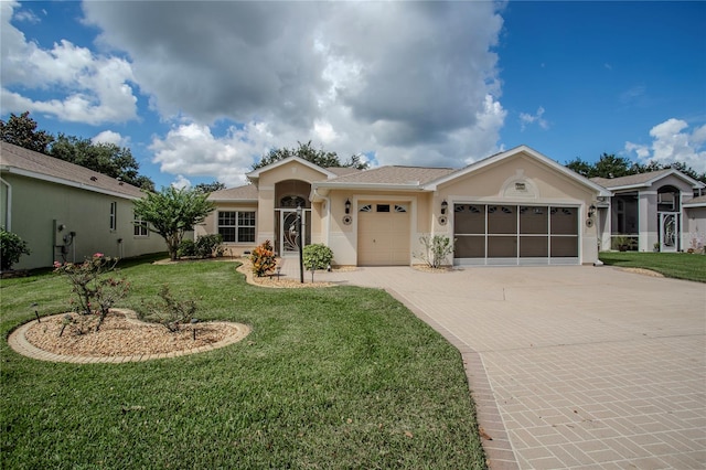 single story home with a garage and a front lawn