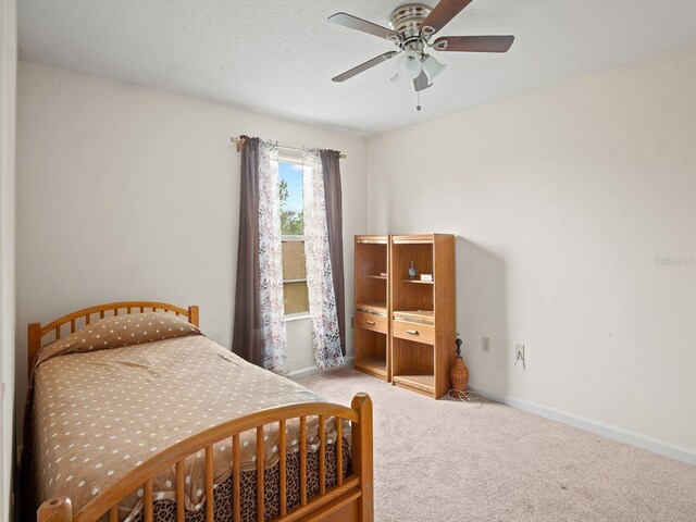 18744 Sabal St, Orlando, FL 32833 - bedroom with carpet flooring, baseboards, and ceiling fan