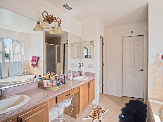 full bathroom featuring a bath, visible vents, a stall shower, and a sink