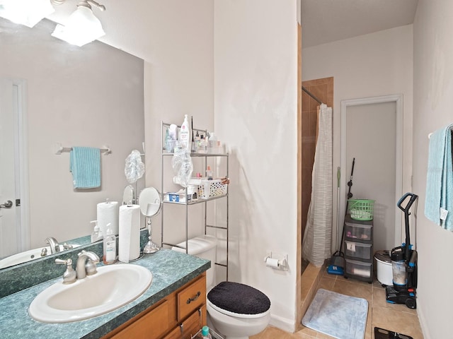 bathroom with tile patterned floors, a shower with curtain, vanity, and toilet