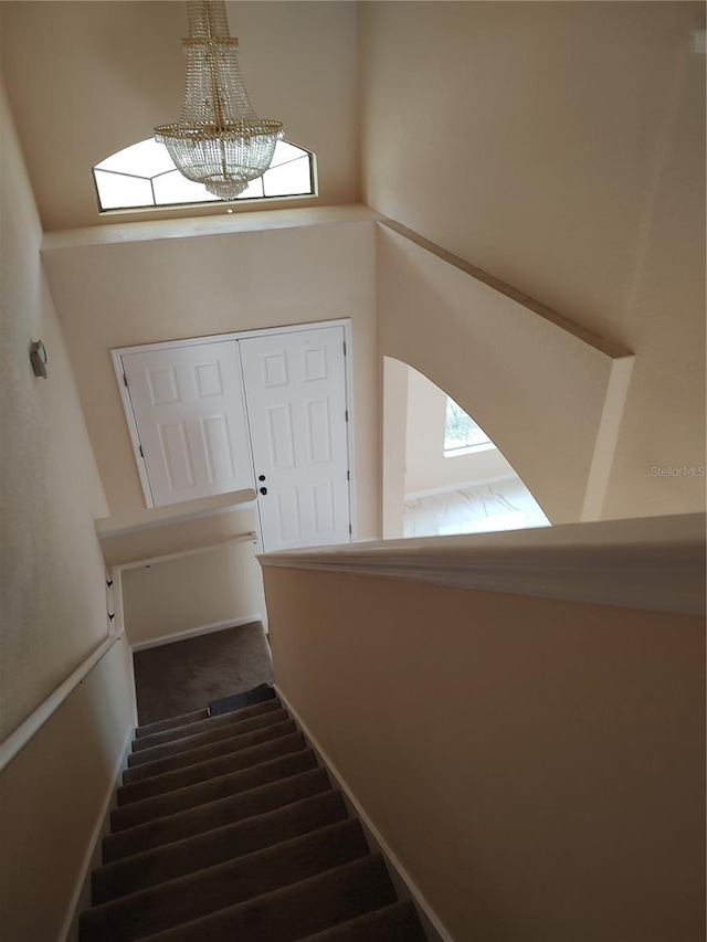 18744 Sabal St, Orlando, FL 32833 - stairs featuring a chandelier and carpet
