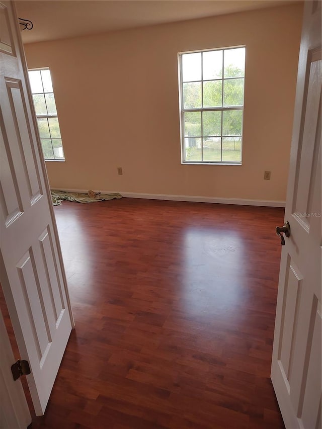 18744 Sabal St, Orlando, FL 32833 - unfurnished room featuring dark wood-style flooring and baseboards