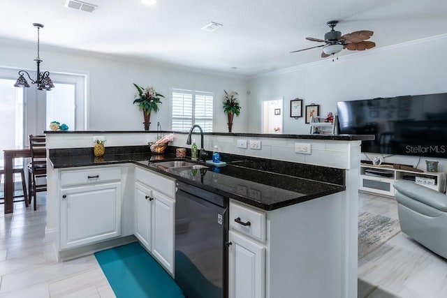 kitchen featuring black dishwasher, a sink, open floor plan, and visible vents