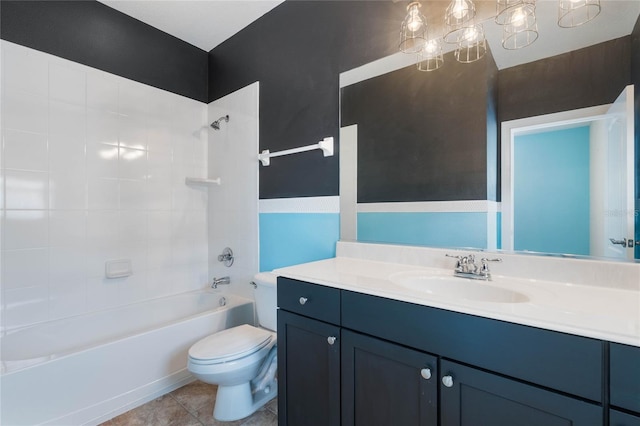 full bathroom with toilet, tiled shower / bath, tile patterned floors, and vanity