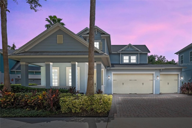 view of front of property with a garage