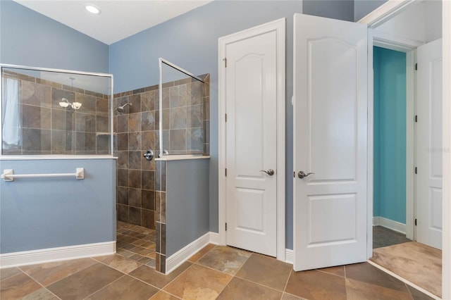 bathroom with a tile shower