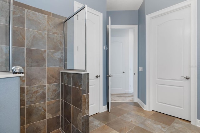 bathroom with tiled shower