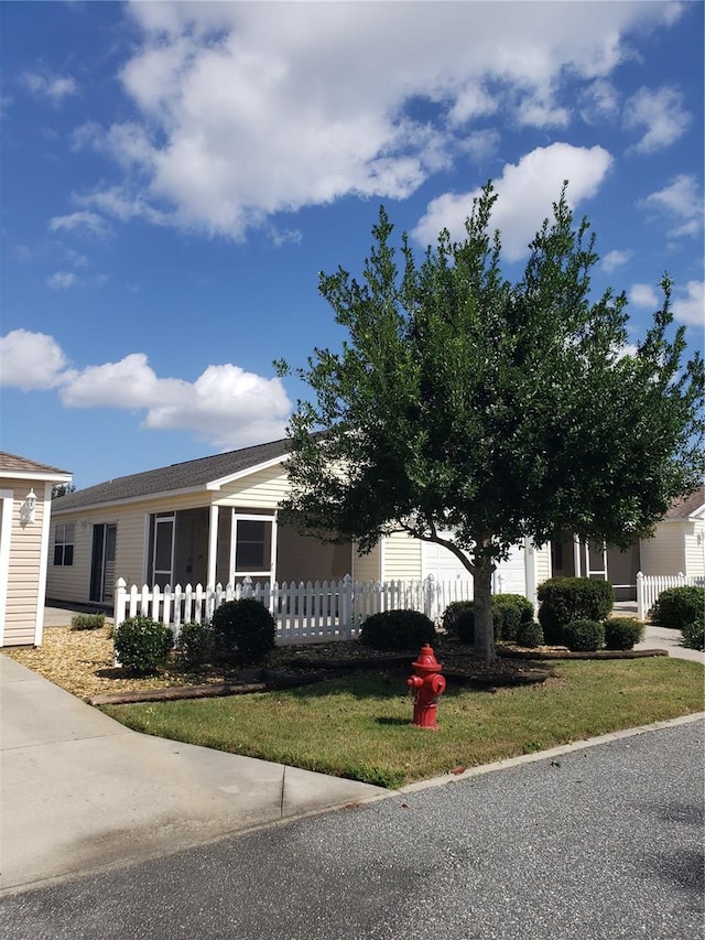 view of front facade with a front lawn and a porch