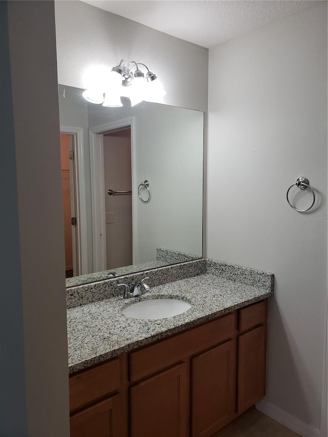 bathroom featuring vanity and a textured ceiling