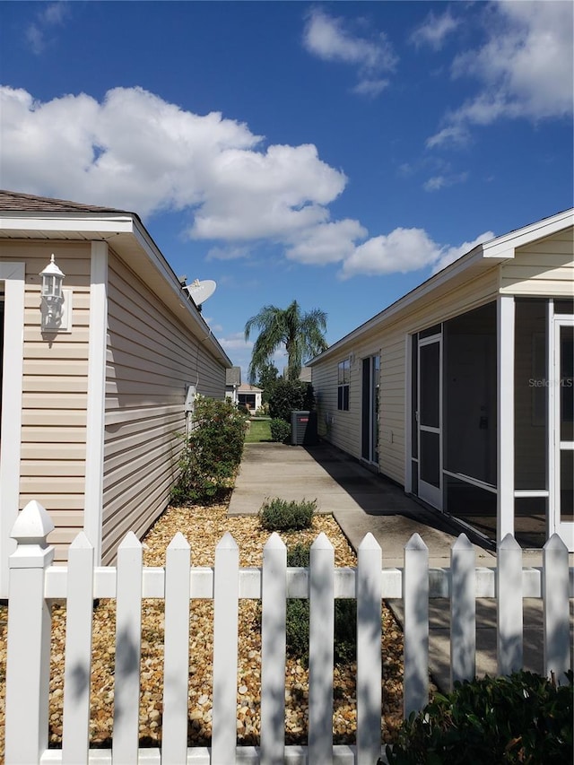 view of yard featuring a patio and a sunroom