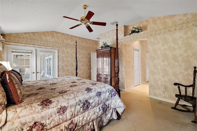 carpeted bedroom with access to outside, french doors, a textured ceiling, ceiling fan, and lofted ceiling