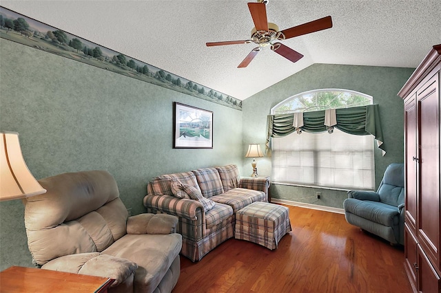 living room with vaulted ceiling, ceiling fan, a textured ceiling, and dark hardwood / wood-style flooring