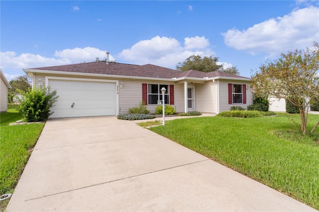 ranch-style home featuring a garage and a front lawn