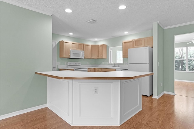 kitchen featuring light brown cabinets, white appliances, light hardwood / wood-style floors, crown molding, and a textured ceiling