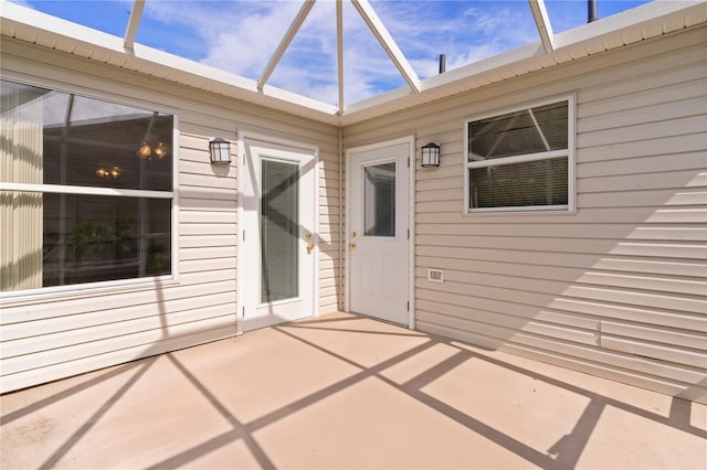 doorway to property featuring a patio