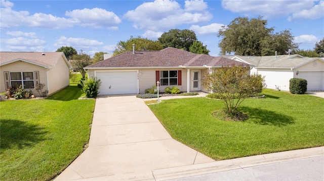 ranch-style house with a garage and a front lawn