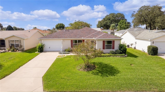 single story home featuring a garage and a front lawn