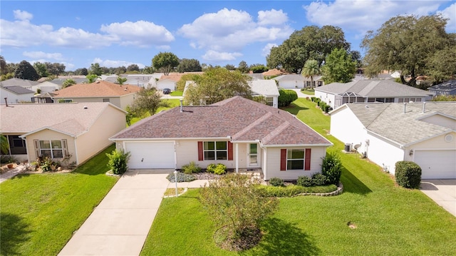 single story home with a front lawn and a garage