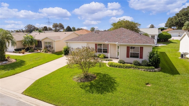 ranch-style house featuring a front yard and a garage