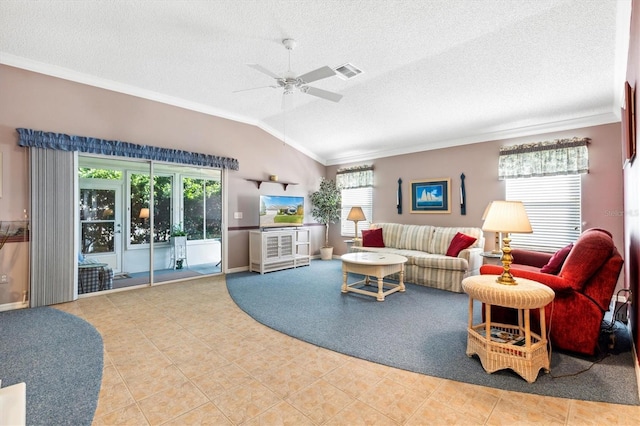 living room with ornamental molding, vaulted ceiling, a textured ceiling, and ceiling fan