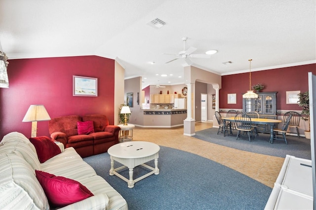 living room featuring ornamental molding, decorative columns, vaulted ceiling, and ceiling fan