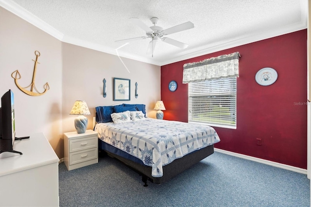 bedroom featuring ornamental molding, carpet, a textured ceiling, and ceiling fan