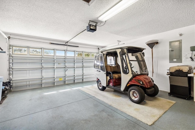 garage featuring electric panel and a garage door opener