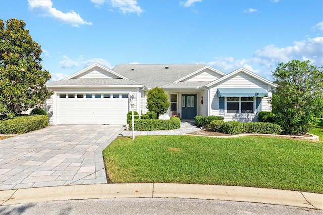 ranch-style house with a front lawn and a garage