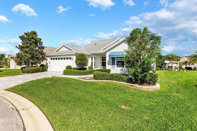 view of front of home featuring a front yard and a garage