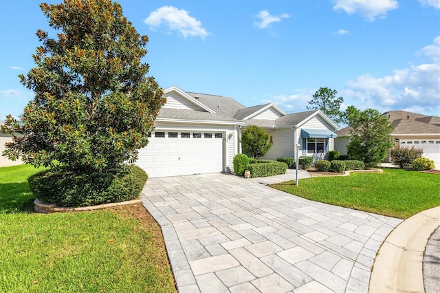 view of front of property featuring a front lawn and a garage