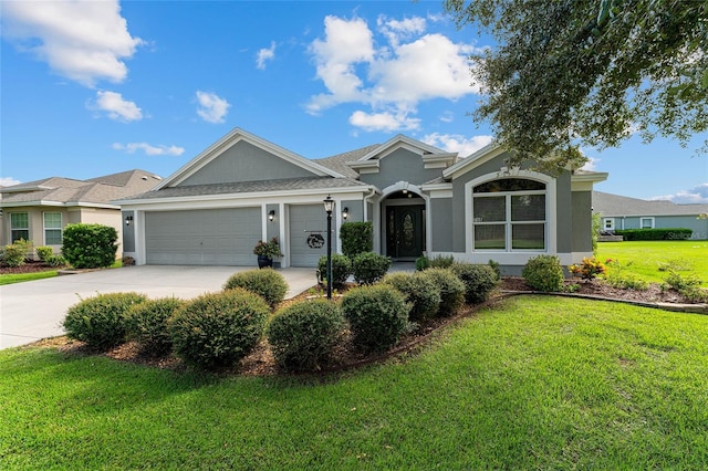 single story home featuring a garage and a front yard